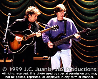 Dylan on harp with Phil: Photo by J.C. Juanis